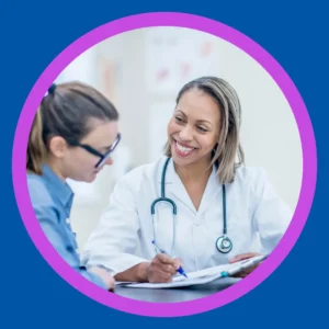 A woman talks to her audiologist. 