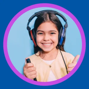A girl taking a hearing test smiles.