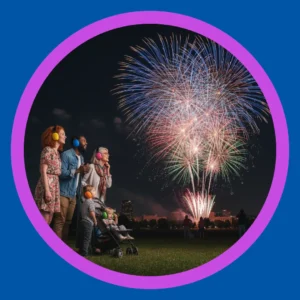 A family watches fireworks.