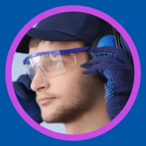 A man puts on hearing protection head phones. 