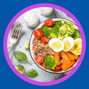 A bowl with a healthy salad sits on a table. 