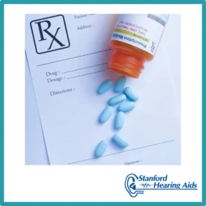 Blue pills sit on a prescription pad.