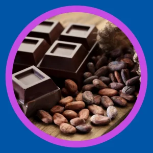 A dark chocolate bar and cocoa beans sit on a table.