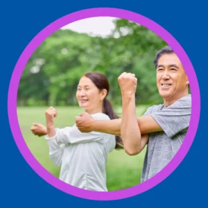 A couple stretches outside.