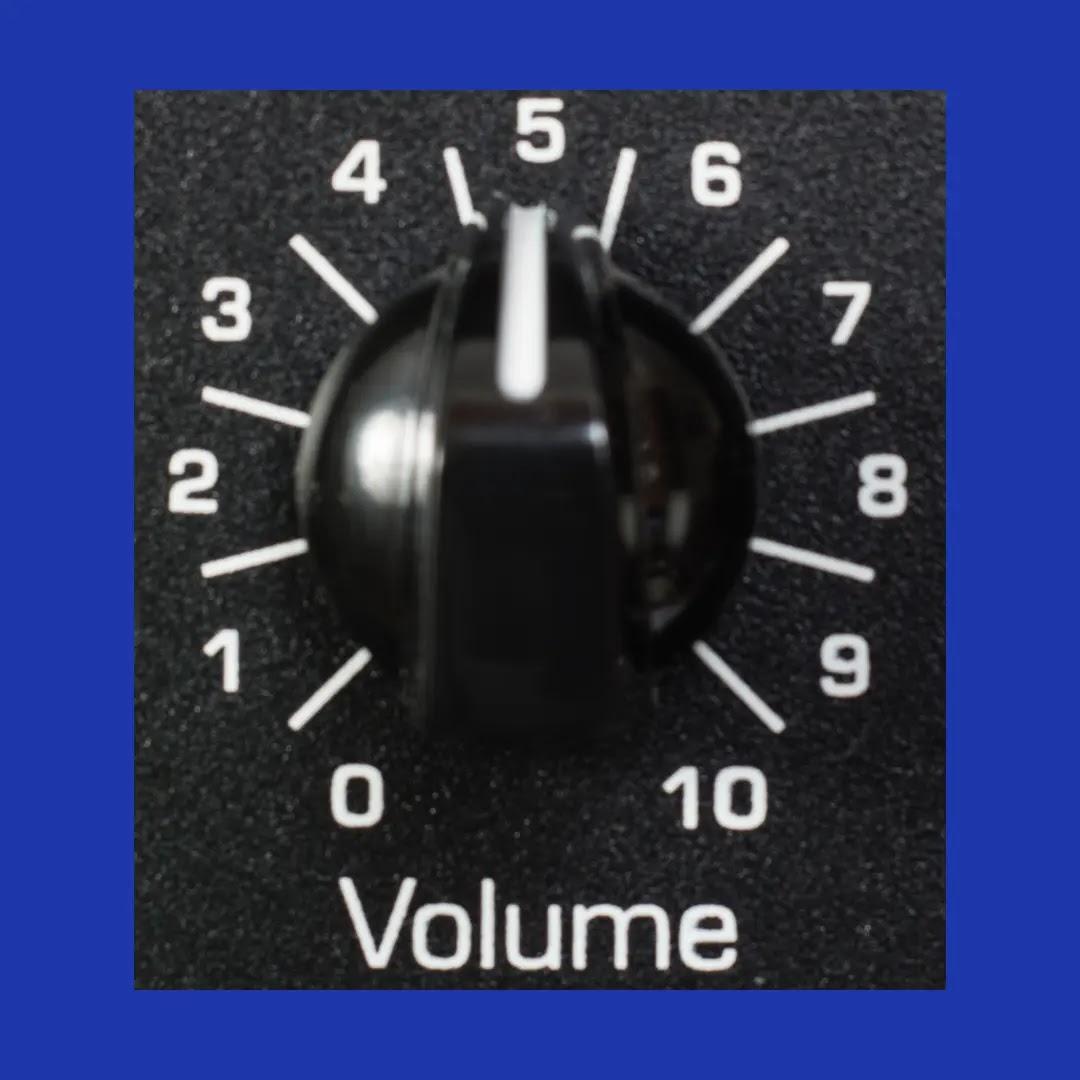 A block volume dial points to 5, which is in the middle.