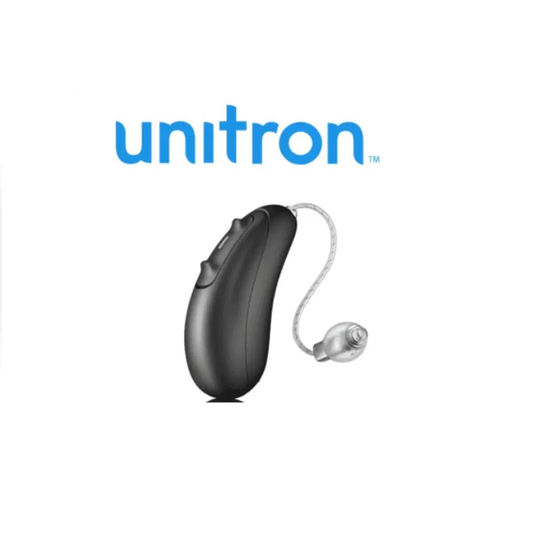 A black Unitron hearing aid rests on a white background.