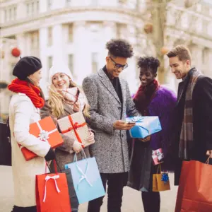 Friends shop outside in the winter cold.