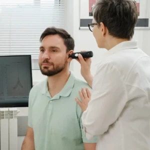 A man gets his hearing checked. 