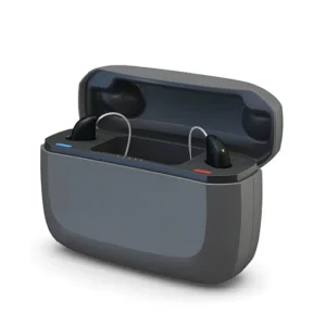 A pair of ReSound hearing aids rest in their charging case. 