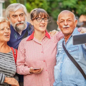 Two older couples pose for a selfie. 