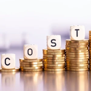 Growing stacks of coins have the word “cost” spelled out in block letters on top. 