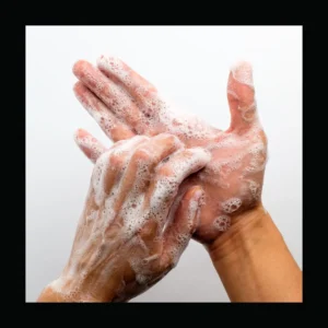 Hands covered in soap bubbles wash. 