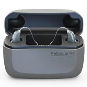 ReSound hearing aids sit in their charging case. 