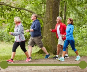 Older couples walk on an outdoor trail. 