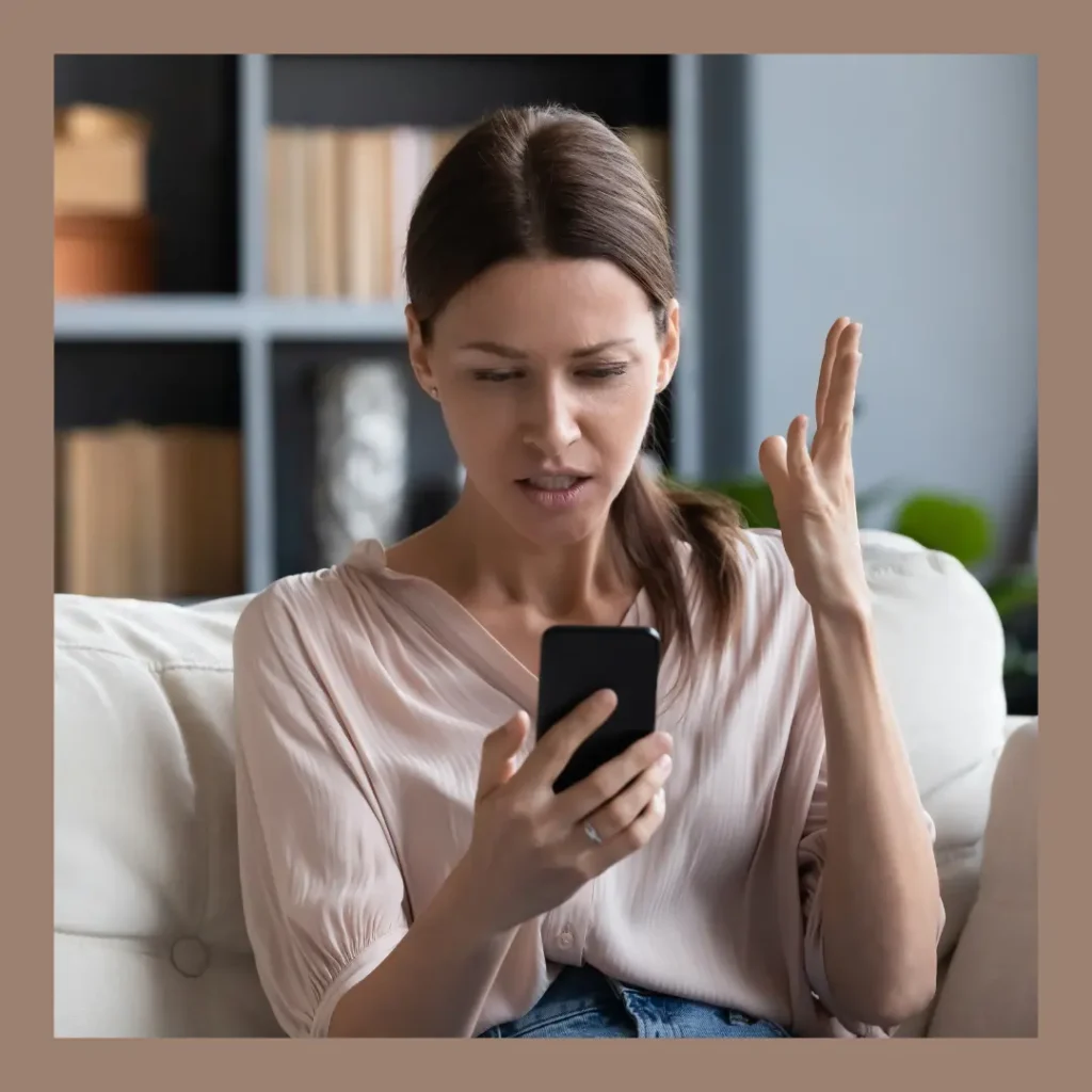 A woman throws her hand up in exasperation during a video call.
