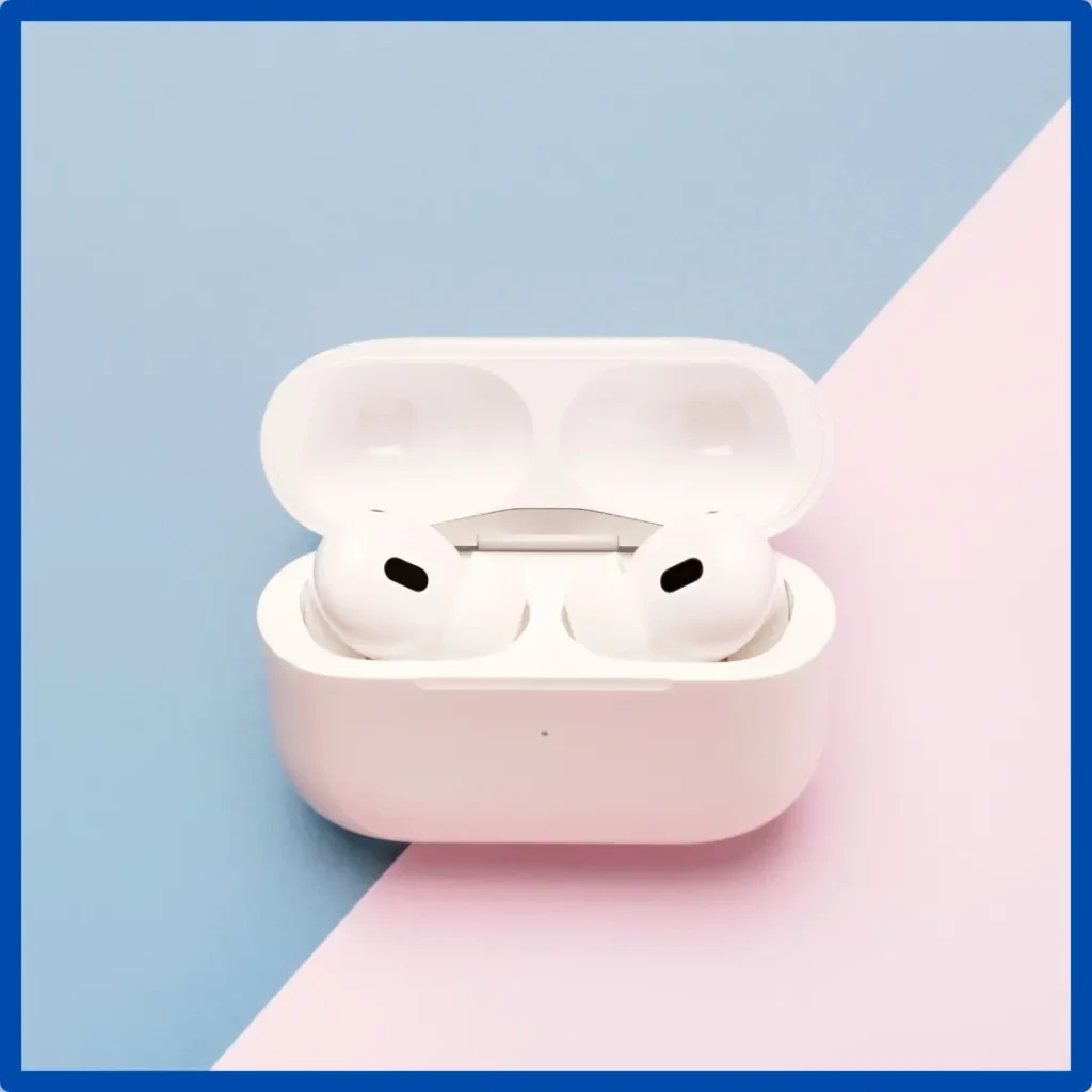 A pair of AirPods set in their charging case.