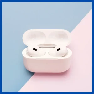 A pair of AirPods set in their charging case.