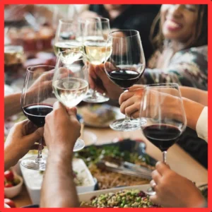 People toast at a noisy restaurant. 