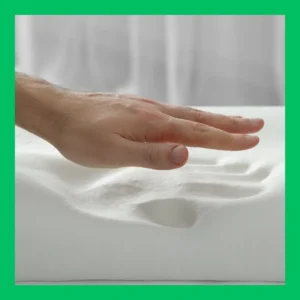 A hands pulls away from a memory foam pillow.