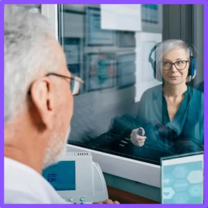 An audiologist tests a patient's hearing.