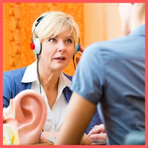 A woman takes a hearing test. 