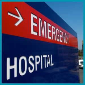 A hospital emergency sign stands against a blue background. 