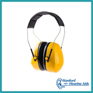 Yellow ear protectors sit on a white background. 