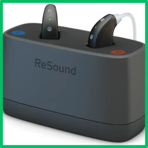 ReSound hearing aids sit in their charging case. 
