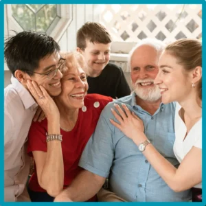 A family smiles and laughs together. 