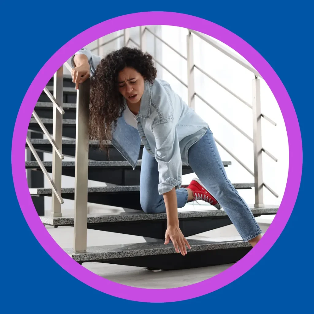 A woman falls down the stairs.