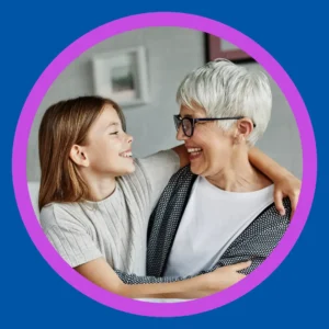 A woman hugs her granddaughter. 