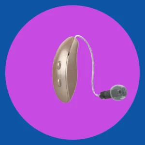 A silver Starkey hearing aid sits on a purple background. 