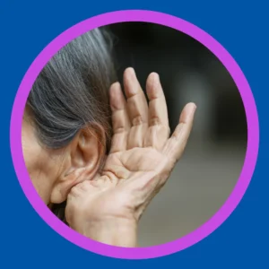 An older woman cups her hand around her ear.
