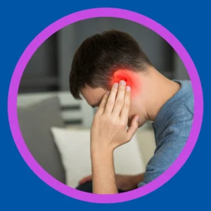 A man holds his reddened ear.