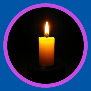 A lit candle stands against a black background.