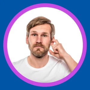 A man reaches into his ear. 