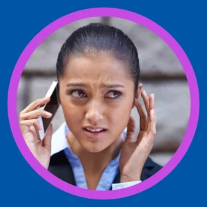A woman struggles to hear a phone call. 