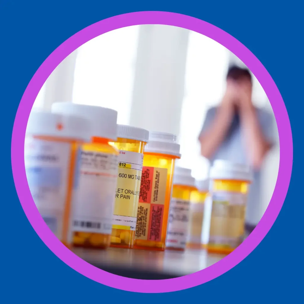 A line of pill bottles sits across a table.
