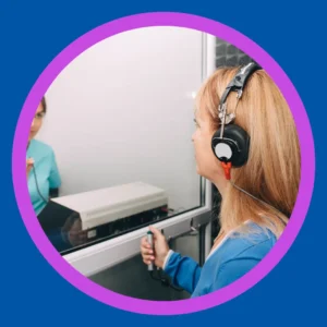 A woman takes a hearing test. 
