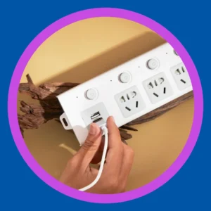 Hands plug a cord into an extension plug. 