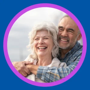 An older couple smiles together.