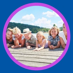An extended family enjoys time at a lake.