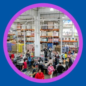 People walk around a warehouse store. 