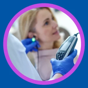 An audiologist uses real ear measurement on a patient. 