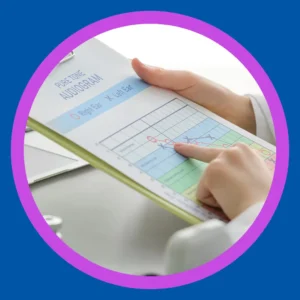 An audiologist holds an audiogram. 