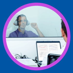 A man gets his hearing tested. 