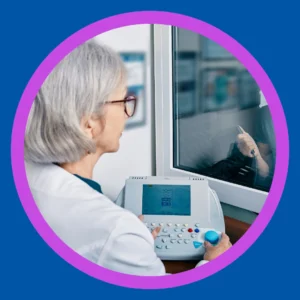 An audiologist tests someone's hearing. 