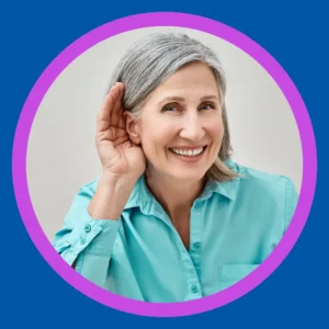 A woman cups her ear to hear better.