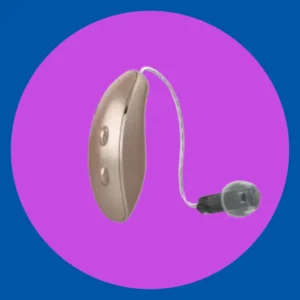A gold Starkey Genesis hearing aid stands on  purple background. 
