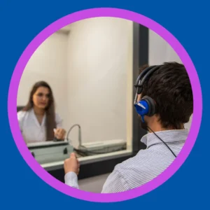 An audiologist tests a man's hearing. 
